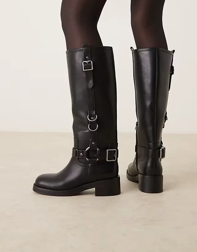 Cobra buckle harness knee boots with silver tone hardware in black