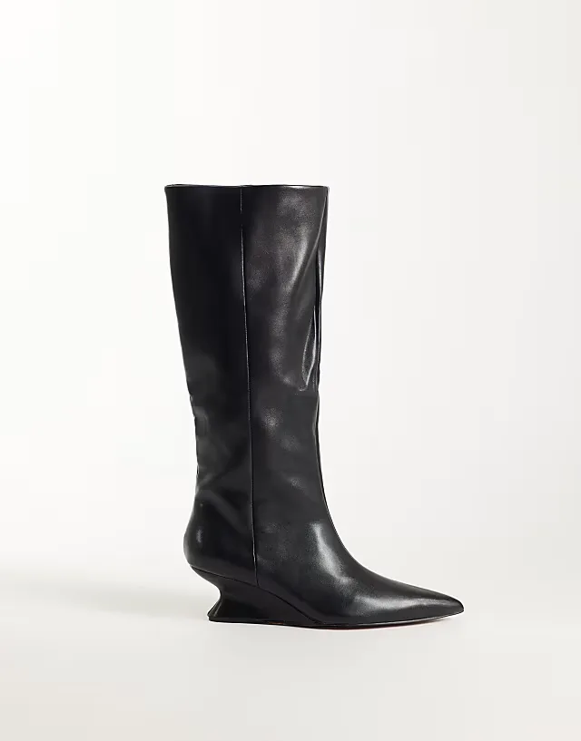 Cinder wedge pull on knee boots in black