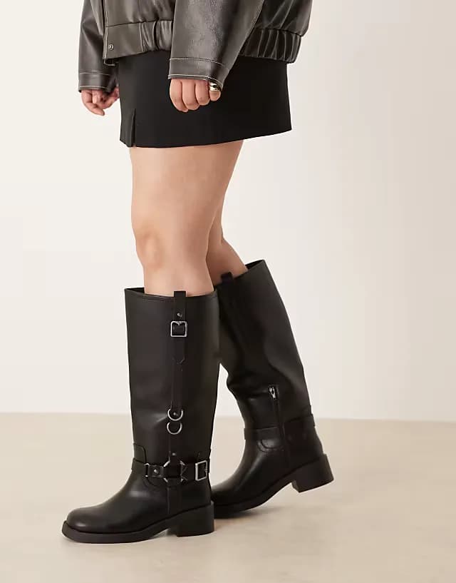 Curve Cobra buckle harness knee boots with silver hardware in black