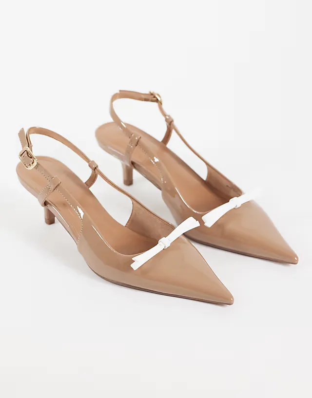 Skippy bow detail slingback kitten heel pumps in beige patent